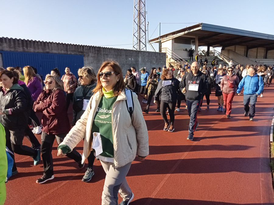 Reportaje | Ribeira se solidariza con el Club de Remo Puebla tanto andando como a la carrera